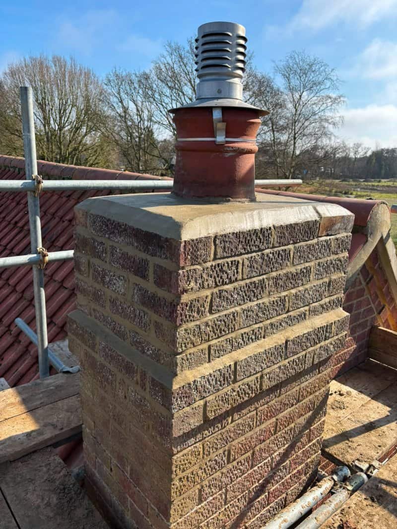 Newly rebuilt brick chimney on a property in Dereham