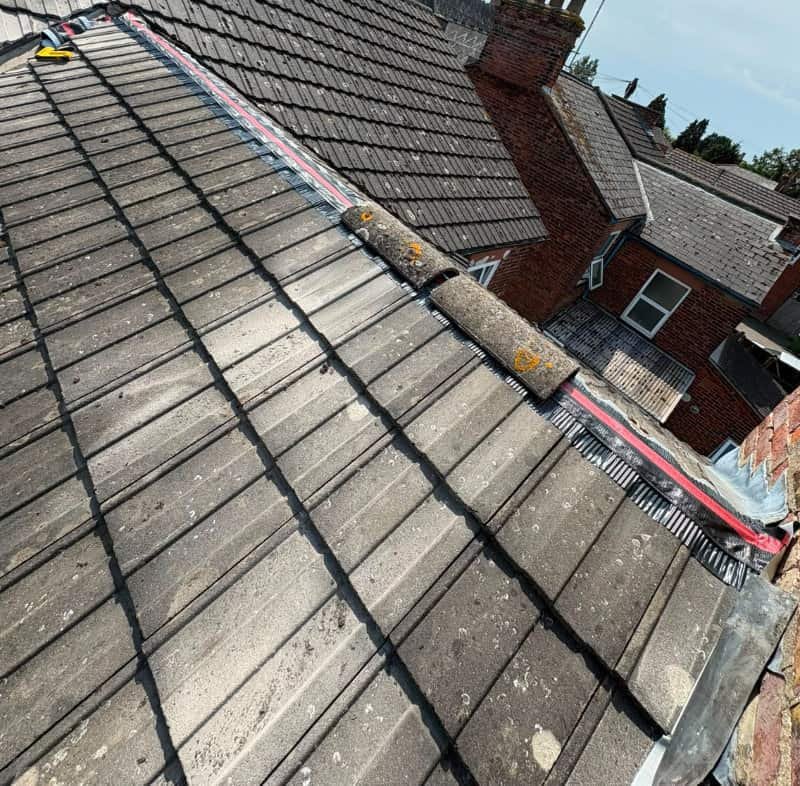Dry verge system part way through installation in Norfolk with the first tile fitted