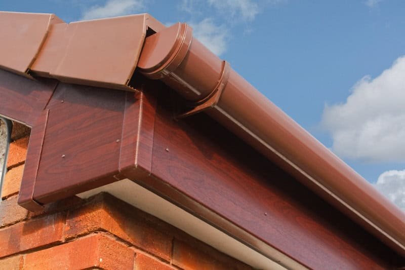 Newly fitted brown guttering on a property in Norfolk